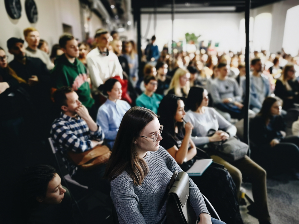 people attending a podcast event